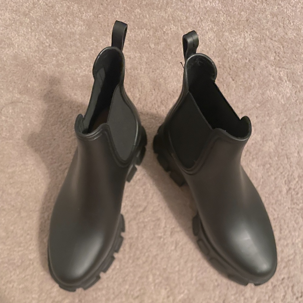 Matted black Jeffrey Campbell rain boots.